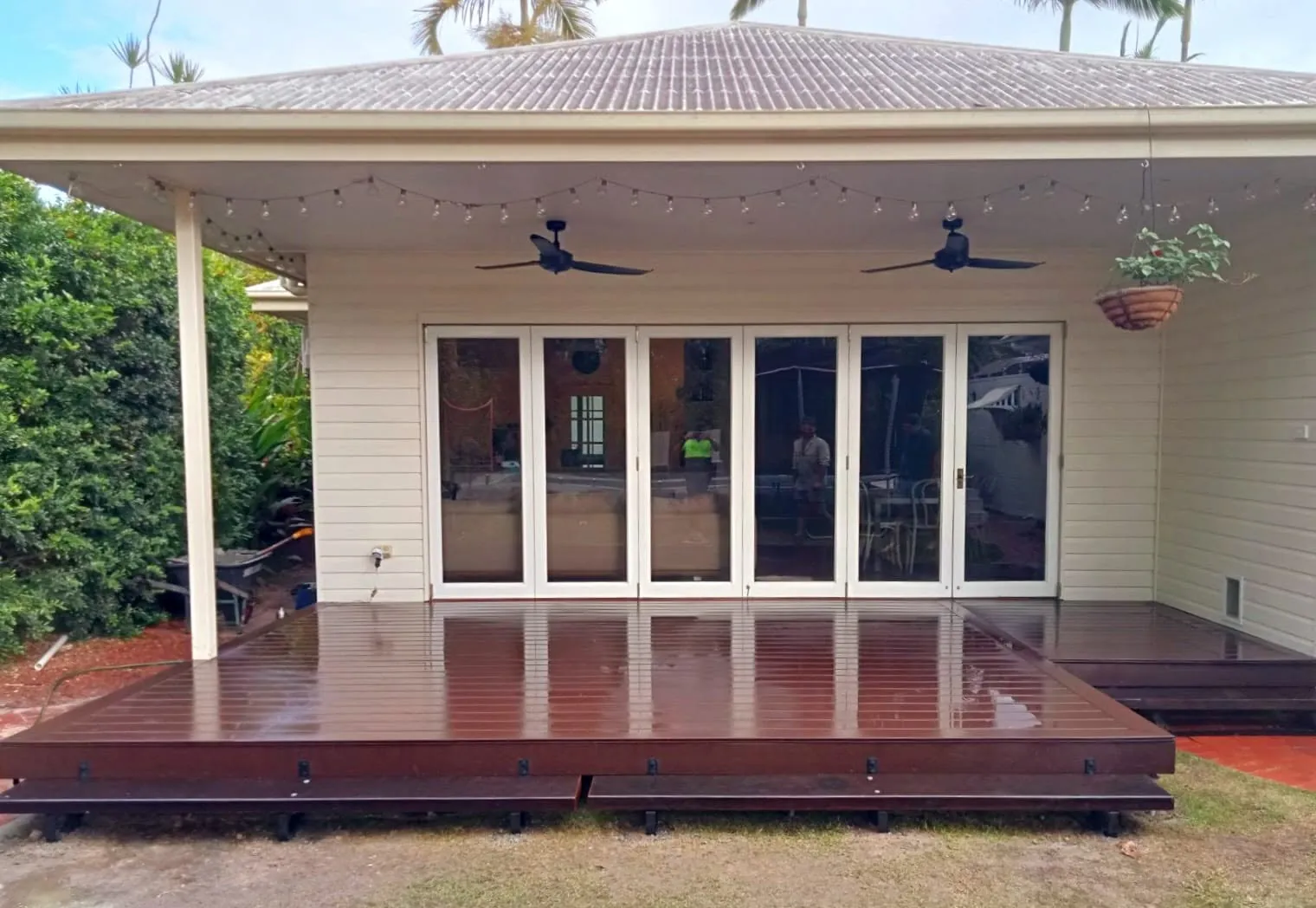 Timber deck built across the rear of a home with bifold doors opening onto it
