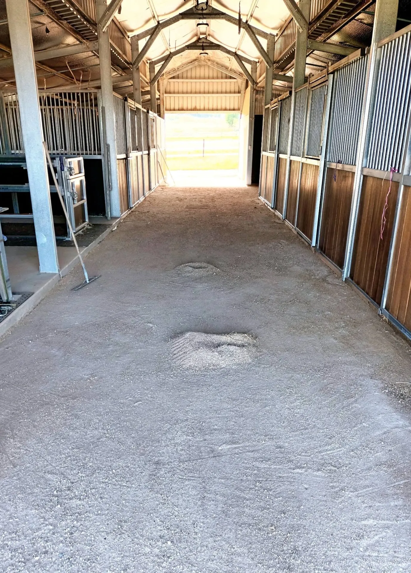 Bare concrete stable breezeway before paving works began